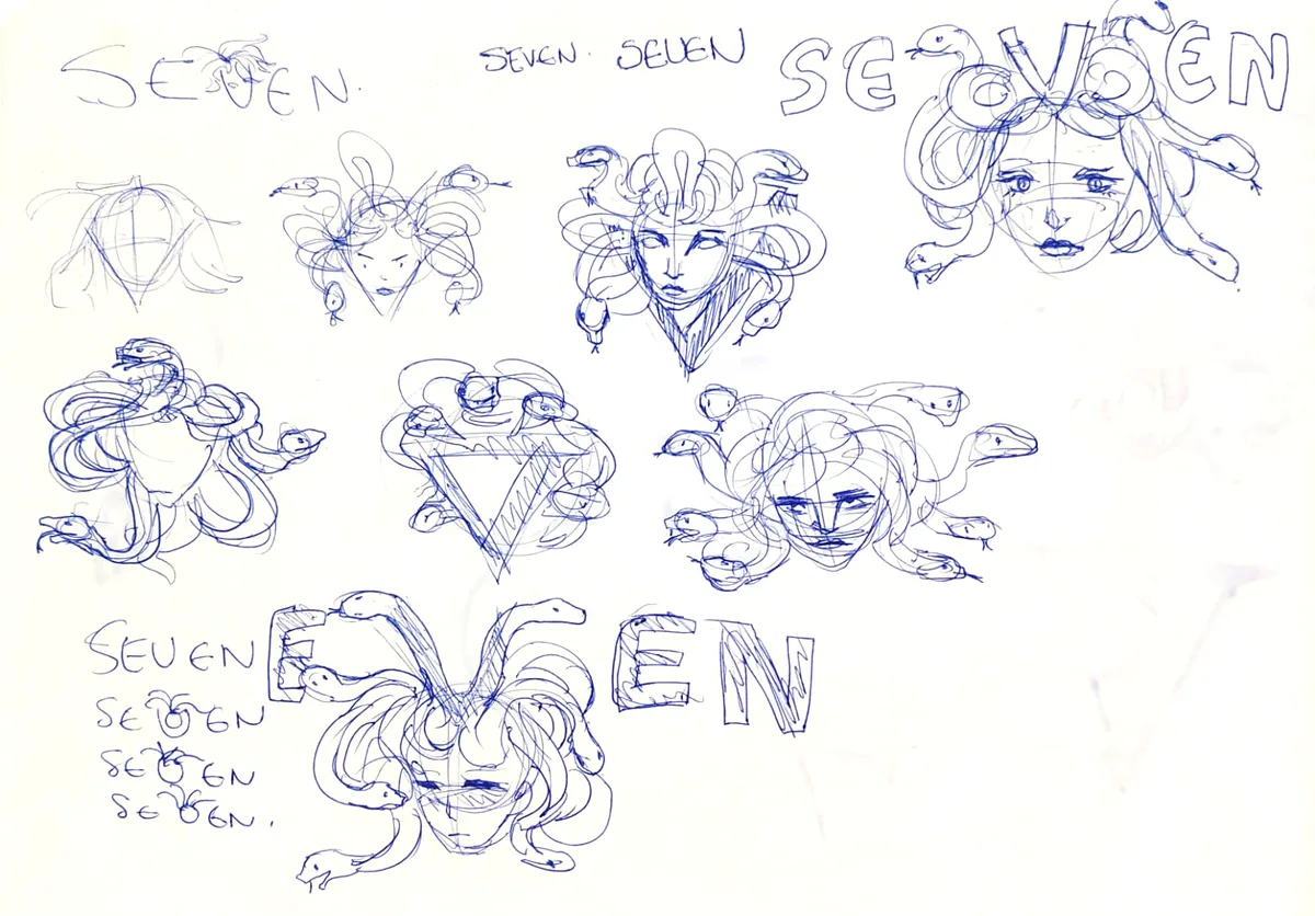 Blue ballpoint page of Medusa heads with snake hair, one in a V-shaped collar, and SEVEN lockups where snakes form the V.